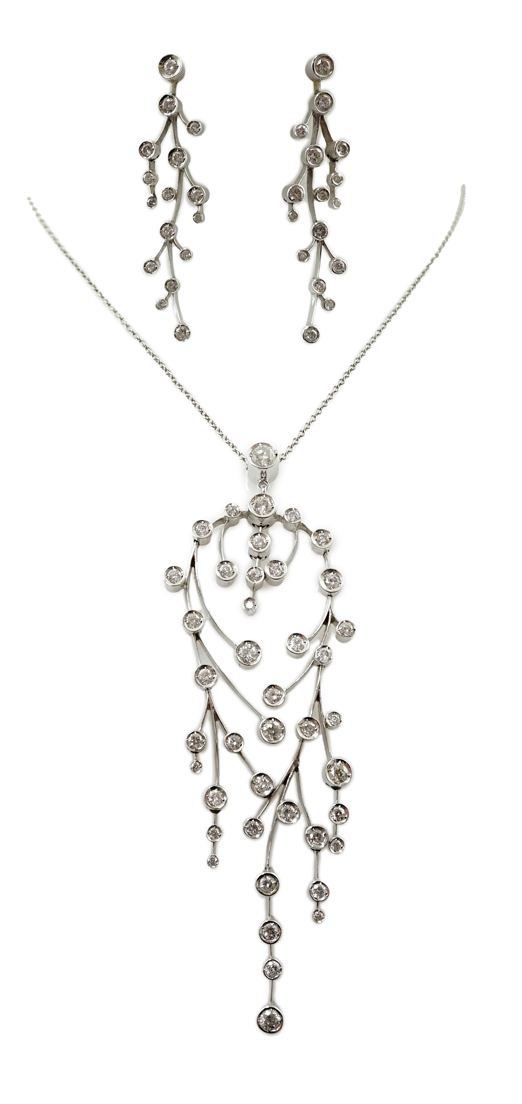 A modern 18ct white gold and diamond cluster set drop pendant on chain, together with a pair of matching drop earrings